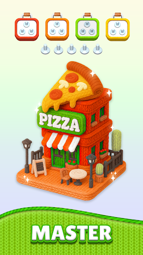 Ręka przeciągająca nić między kłębkami wełny